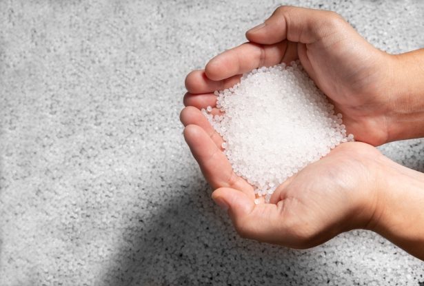 engineer hold white plastic on hand polymer petrochemical product as polymer raw material for plastic in polymer chemical industry design and test in polymer science laboratory